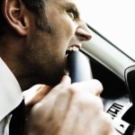 Frustrated and angry man stuck in traffic experiencing road rage