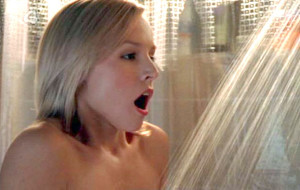 Hot blonde girl taking a cold shower