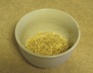 Dry oats in a white bowl