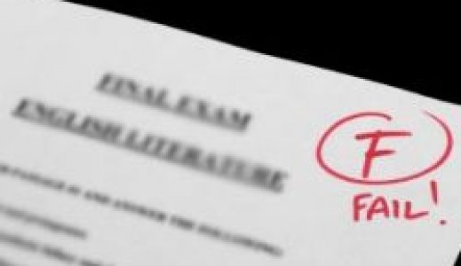 An F failing grade written in red pen on a final exam