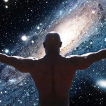 Muscular bald man opening his arms to the universe to signify openness and spiritual fulfilment
