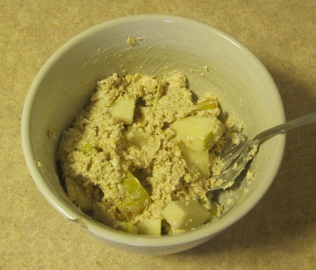 Oatmeal, yogurt and pear in a white bowl