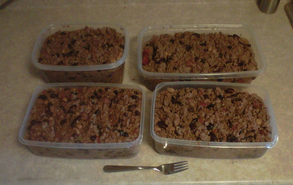 Four large containers full of home cooked chili