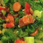 A big salad with carrots, beans, kale, cucumber, apple and more